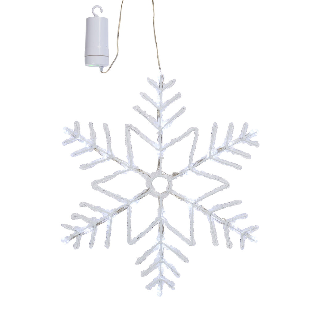 Weiße LED-Schneeflocke mit Timer und Batteriefach vor weißem Hintergrund